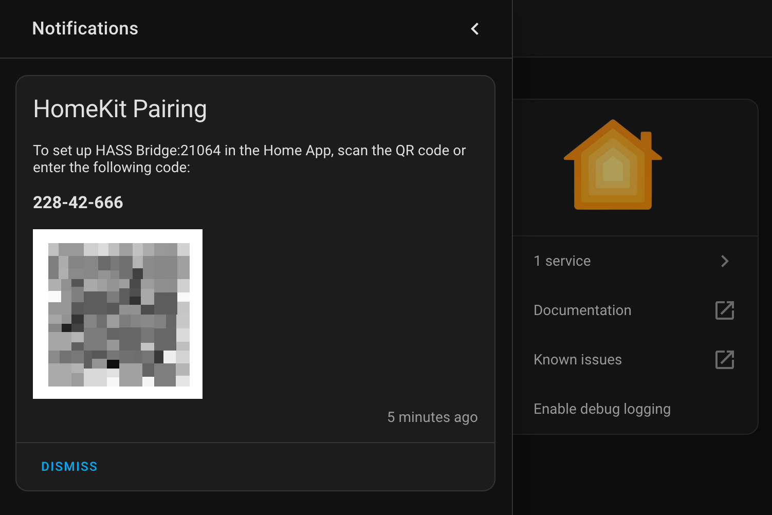 A screenshot of Home Assistant notification for HomeKit Pairing with a code and QR code blurred.